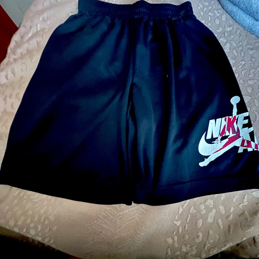 Boys size medium Nike air shirts black in color